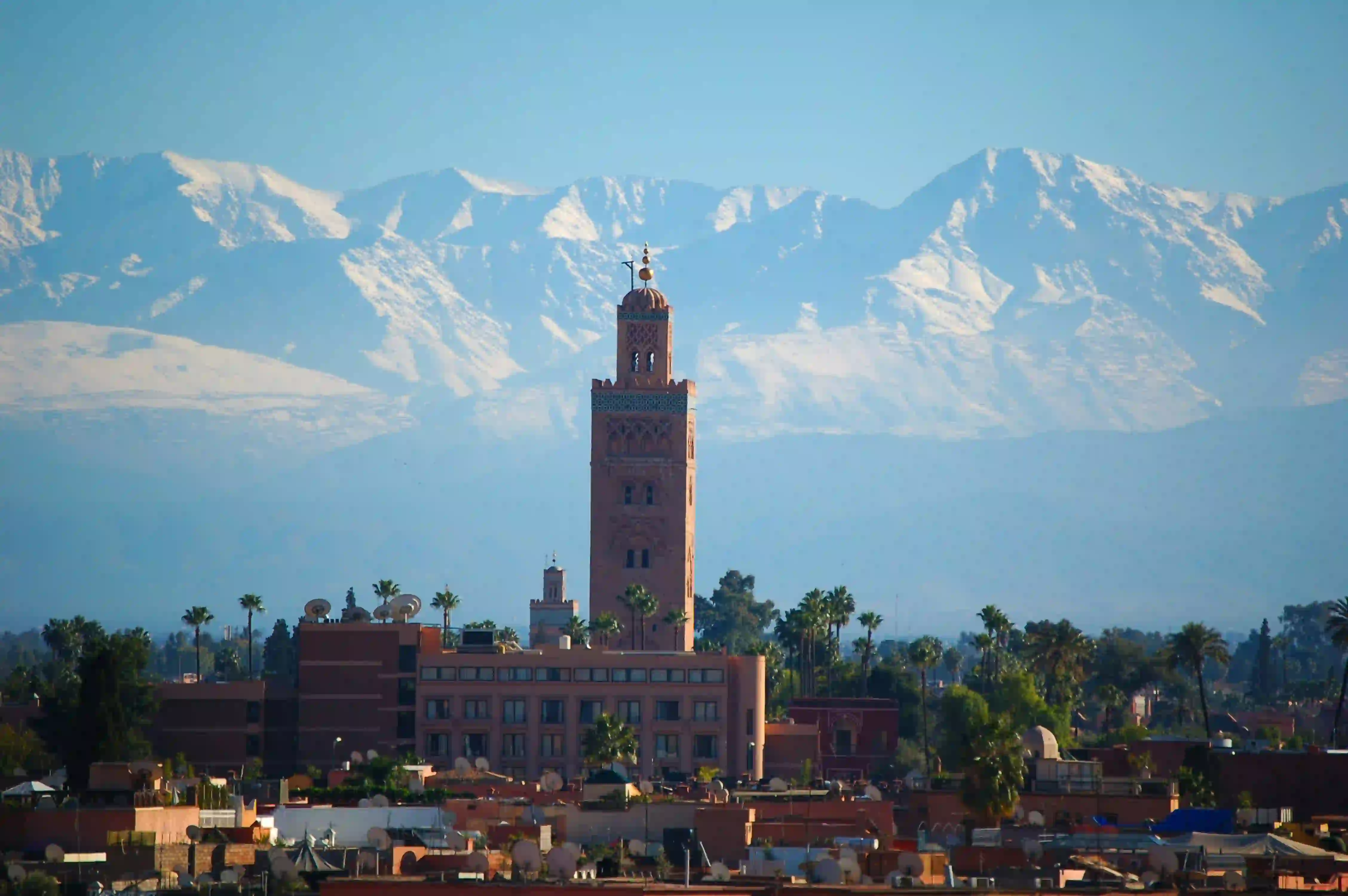 Marrakech rooftops with the Atlas mountains rising behind them