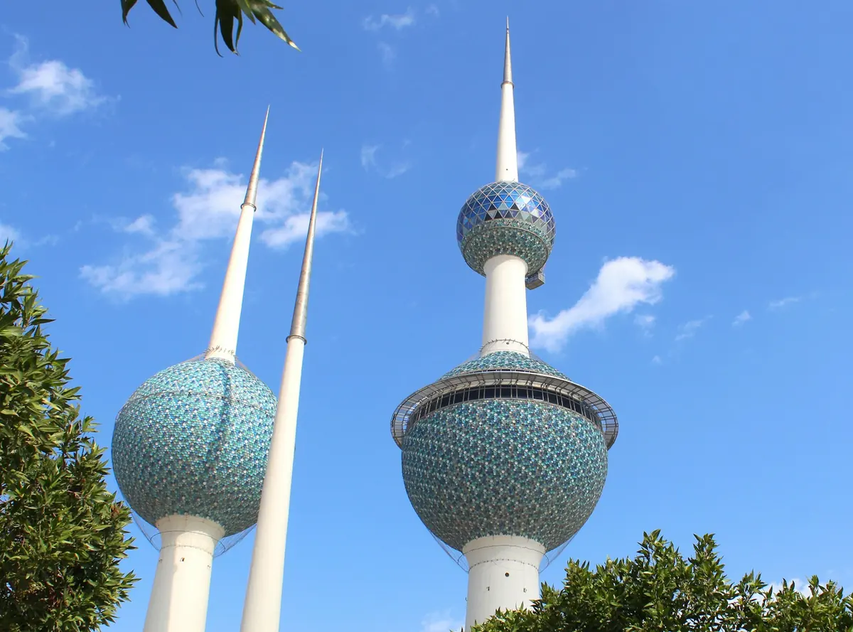 Kuwait Towers rising into a blue sky, the most recognizable landmark of Kuwait City